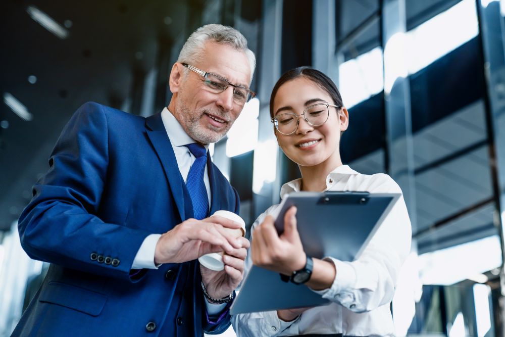 Businessman reviewing the shown documents 