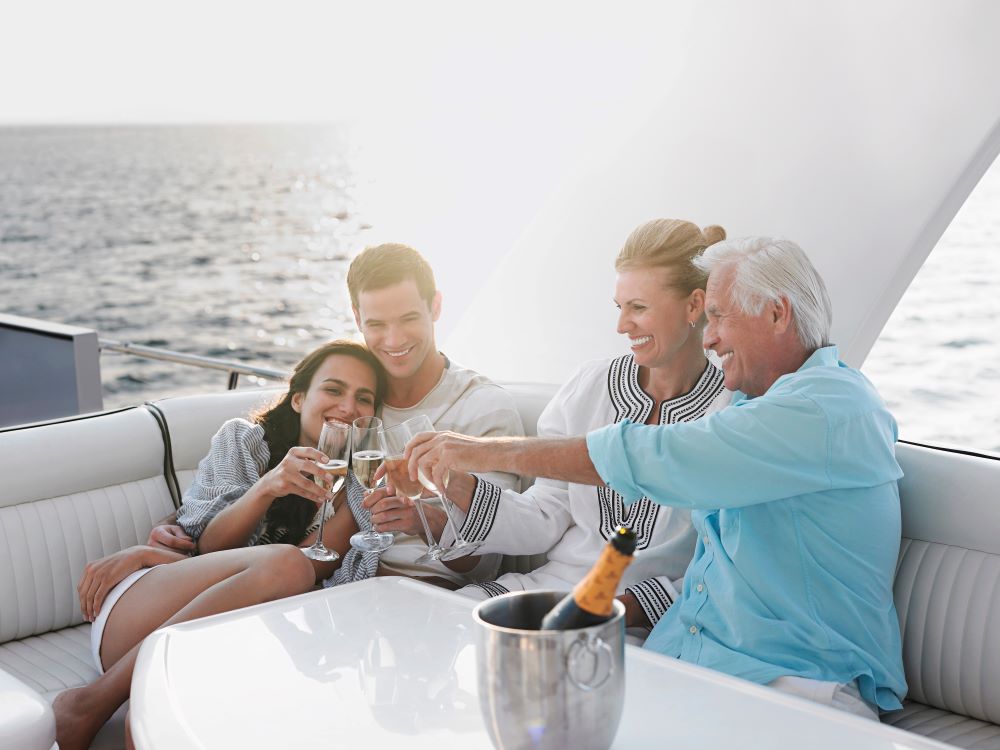 Family having champagne on a yacht